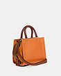 COACH®,ROGUE BAG 25 IN COLORBLOCK,Pebble Leather/Smooth Leather/Suede,Medium,Brass/Papaya Multi,Angle View