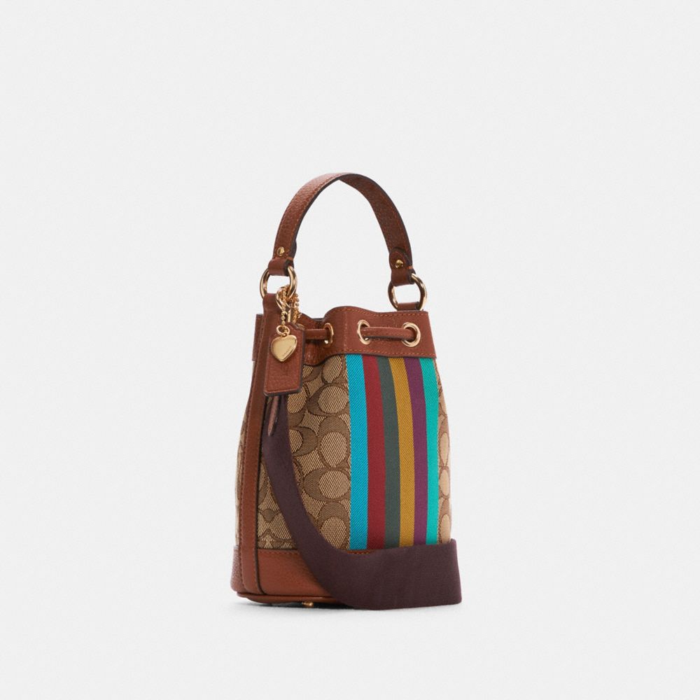 COACH®,Dempsey Drawstring Bucket 15 In Signature Jacquard With Stripe And Coach Patch,,Angle View