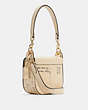 COACH®,COACH X JEAN-MICHEL BASQUIAT KLEO SHOULDER BAG 17,Pebble Leather,Small,Gold/Ivory Multi,Angle View