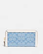 COACH®,ACCORDION ZIP WALLET IN SIGNATURE CHAMBRAY,Signature chambray,Mini,Brass/Light Washed Denim Chalk,Front View