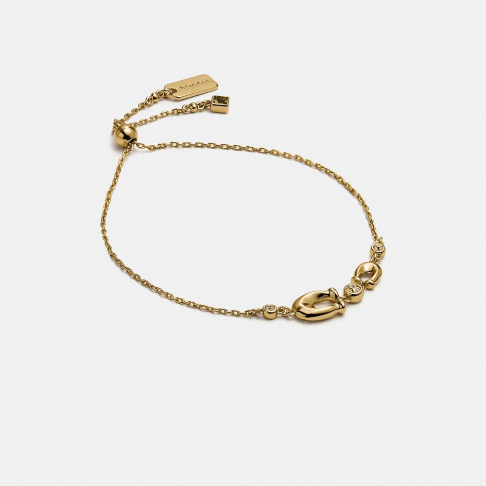COACH®,SIGNATURE CRYSTAL SLIDER BRACELET,Plated Brass,Gold/Clear,Front View