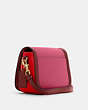 COACH®,SADDLE IN COLORBLOCK WITH HORSE AND CARRIAGE,Small,Gold/Bright Violet Multi,Angle View