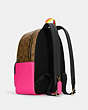 COACH®,COURT BACKPACK IN COLORBLOCK SIGNATURE CANVAS,pvc,Large,Gold/Khaki/Flrsnt Pnk,Angle View