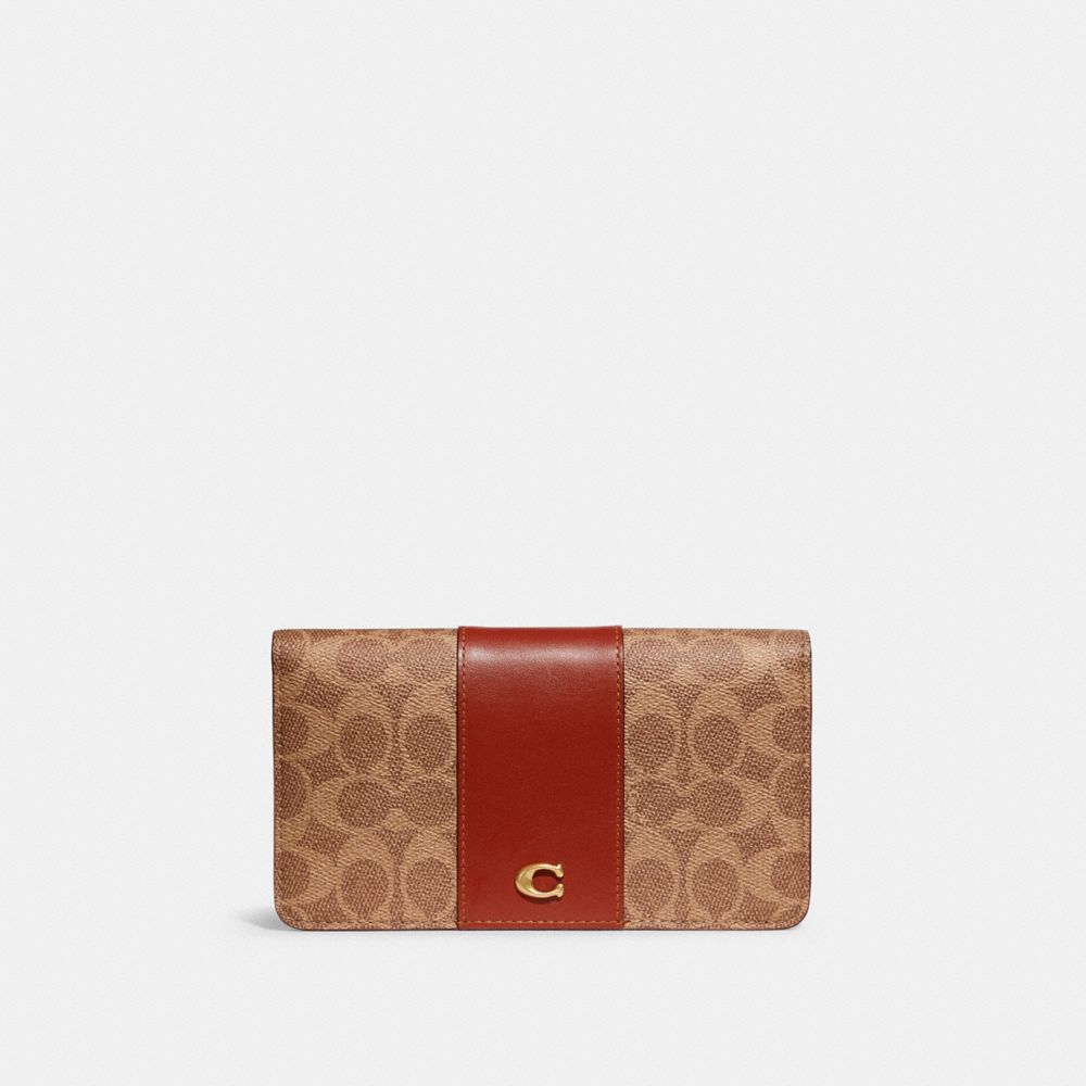 COACH®,SLIM WALLET IN SIGNATURE CANVAS,Signature Coated Canvas/Smooth Leather,Brass/Tan/Rust,Front View image number 0