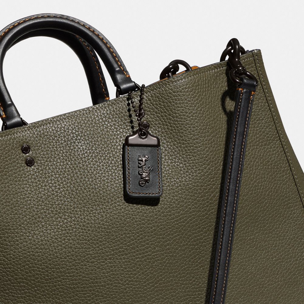 Coach rogue online green