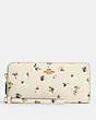 COACH®,CONTINENTAL WALLET WITH PAINT DAB FLORAL PRINT,Pebble Leather,Mini,Brass/Chalk Multi,Front View