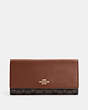 COACH®,SLIM TRIFOLD WALLET IN SIGNATURE CANVAS,pvc,Im/Brown/Redwood,Front View