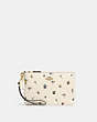 COACH®,SMALL WRISTLET WITH FLORAL PRINT,Pebble Leather/Smooth Leather,Mini,Brass/Chalk Multi,Front View