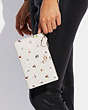 COACH®,SMALL WRISTLET WITH FLORAL PRINT,Pebble Leather/Smooth Leather,Mini,Brass/Chalk Multi,Detail View