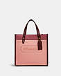 COACH®,FIELD TOTE 22 IN COLORBLOCK WITH COACH BADGE,Pebble Leather/Suede,Medium,Brass/Candy Pink Multi,Front View