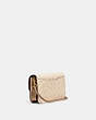 COACH®,DISNEY X COACH HAYDEN CROSSBODY IN SIGNATURE CANVAS WITH PATCHES,Signature Coated Canvas/Pebble Leather/S...,Brass/Sand Taupe,Angle View