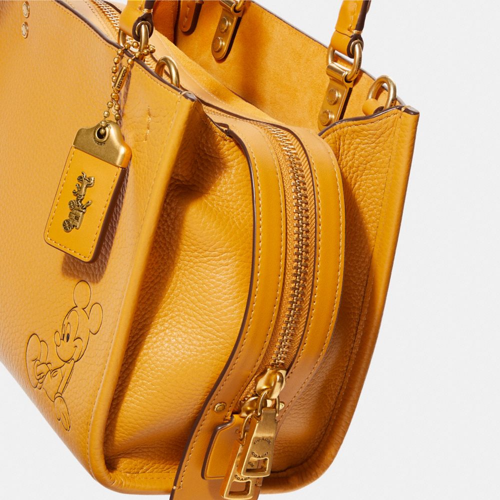 COACH®,Disney X Coach Rogue Bag 25 With Mickey Mouse,,Closer View