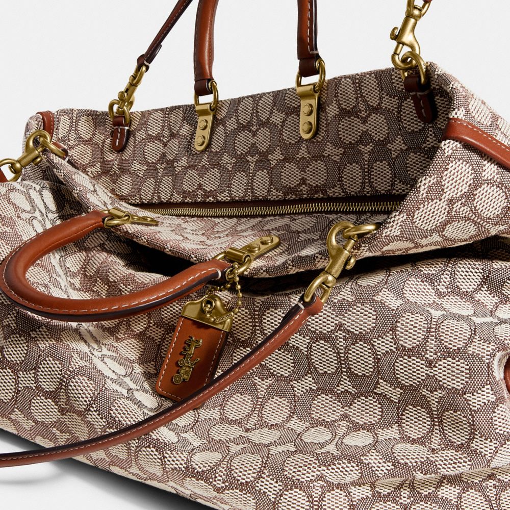 COACH®: Rogue 12 In Signature Textile Jacquard