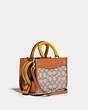 COACH®,ROGUE 17 IN SIGNATURE TEXTILE JACQUARD WITH DUCK MOTIF,Medium,Brass/Cocoa Burnished Amb,Angle View