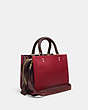 COACH®,ROGUE 25 IN COLORBLOCK,Pebble Leather/Smooth Leather,Medium,Brass/Brick Red Multi,Angle View