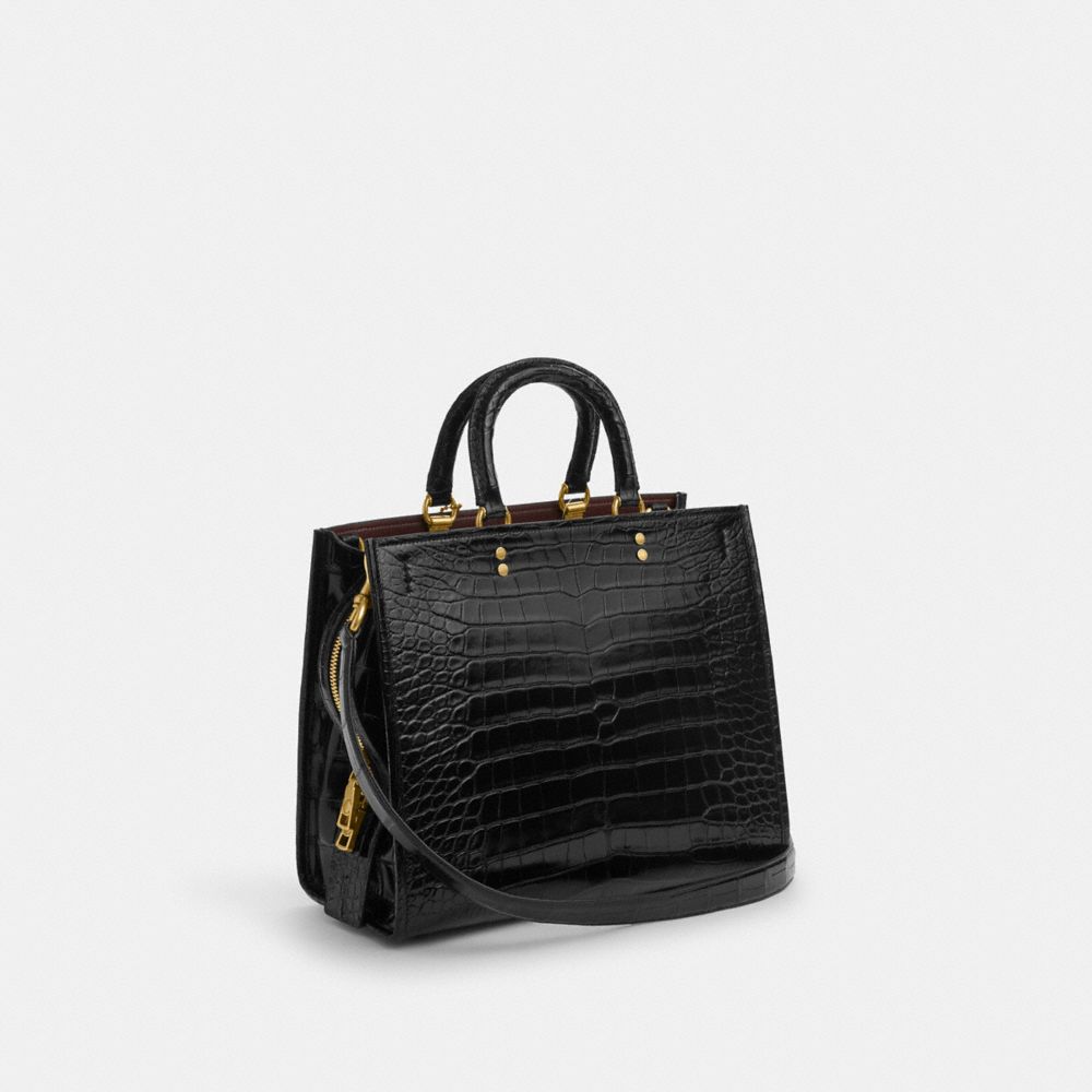 COACH®,ROGUE BAG IN ALLIGATOR,Large,Brass/Black,Angle View