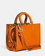 COACH®,ROGUE 17 IN ORIGINAL NATURAL LEATHER,Original Natural Leather,Medium,Brass/Carrot,Angle View