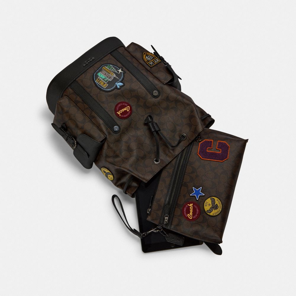 COACH®,Hudson Backpack In Signature Canvas With Souvenir Patches,,Angle View