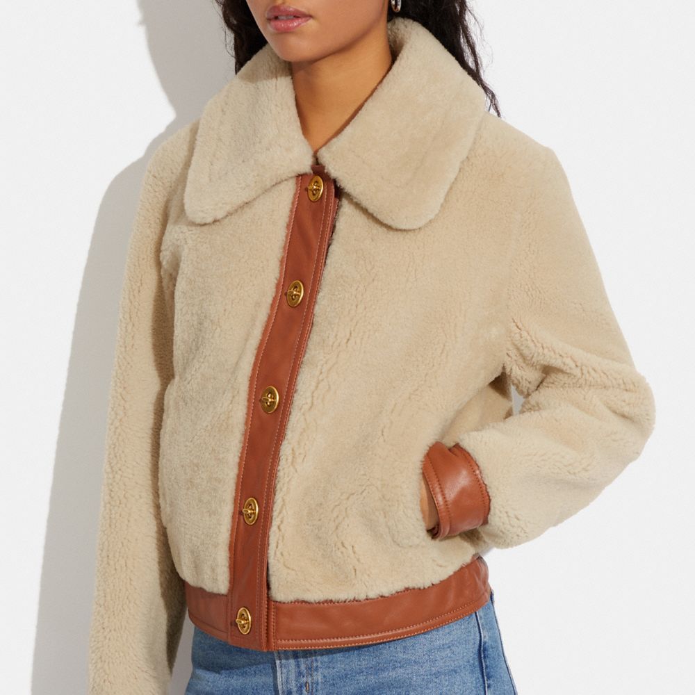 美品♡ COACH コーチ ムートン 毛皮 ラムレザー ジャケット ターンロック 公式】コーチアウトレット | シアリング ターンロック ショート