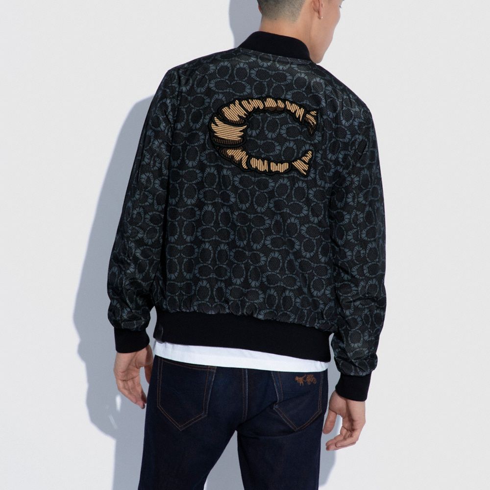 Coach X Michael B. Jordan Veste Ma 1 en cuir réversible à signature momifiée