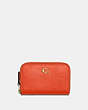 COACH®,SMALL ZIP AROUND CARD CASE,Pebble Leather,Mini,Brass/Sun Orange,Front View
