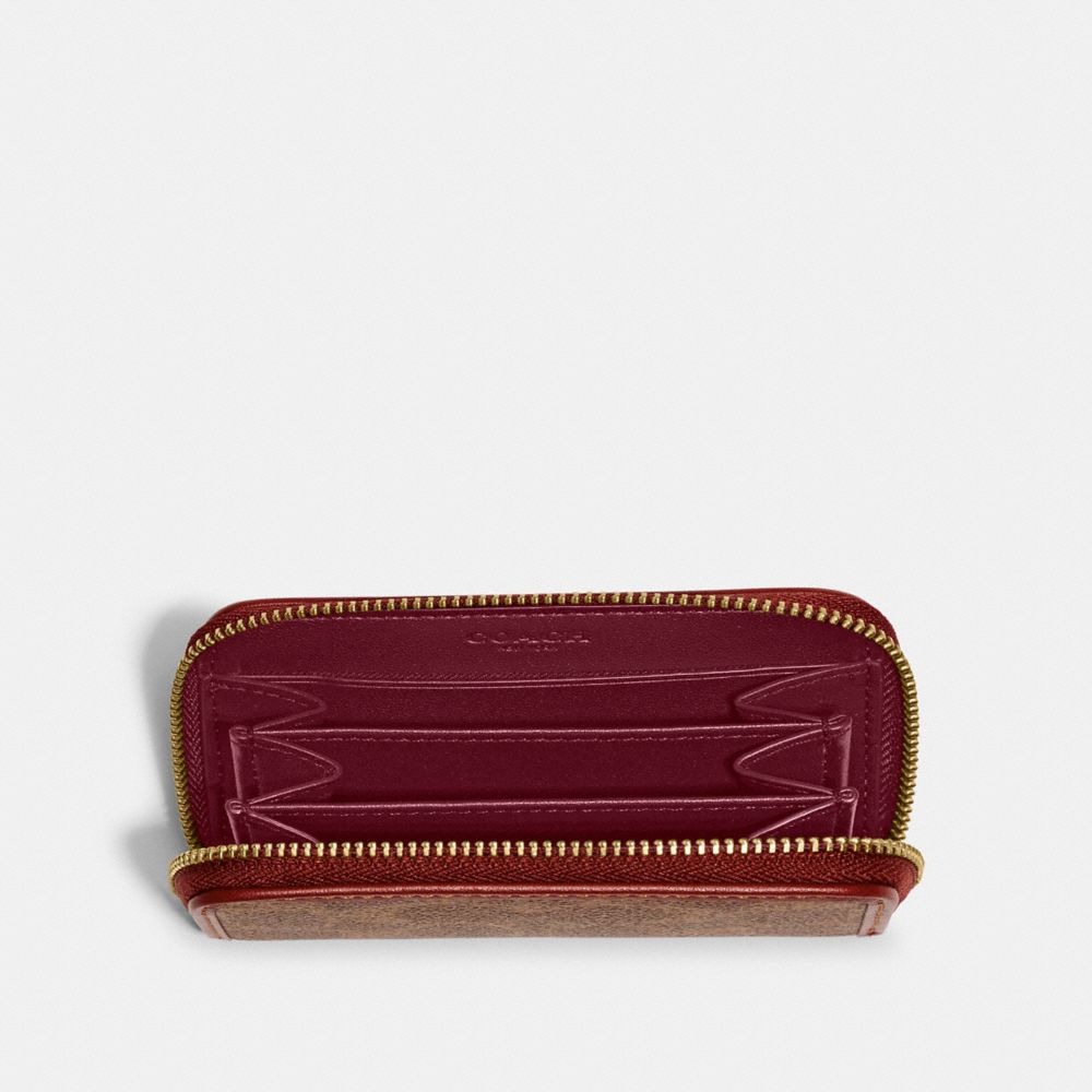 COACH®: Zip Card Case In Signature Canvas