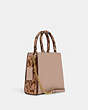 COACH®,MINI PEPPER CROSSBODY,Leather,Small,Gold/Shell Pink,Angle View
