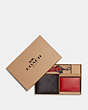 COACH®,BOXED 3-IN-1 WALLET GIFT SET IN COLORBLOCK SIGNATURE CANVAS,Gunmetal/Mahogany/Bright Cardinal,Front View