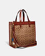 COACH®,FIELD TOTE IN SIGNATURE CANVAS WITH PATCHES,Signature Coated Canvas/Smooth Leather,Medium,Brass/Tan/Rust,Angle View