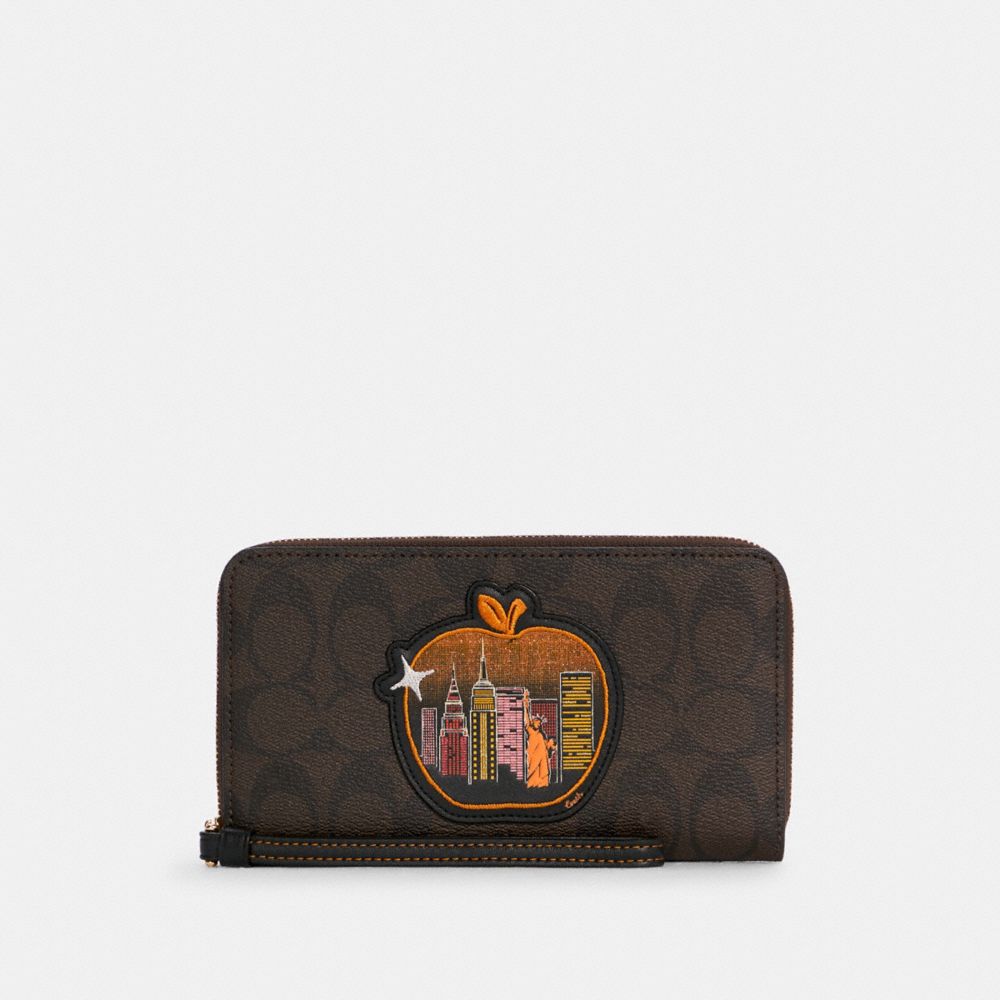 COACH® | Dempsey Large Phone Wallet In Signature Canvas With