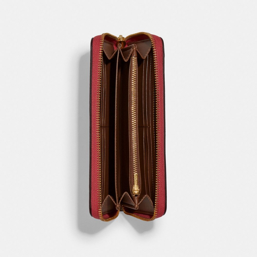 Long portefeuille zippé en toile exclusive avec écussons disco