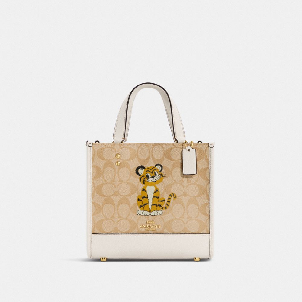 COACH® | Dempsey Tote Bag 22 In Signature Canvas With Tiger