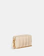COACH®,KIRA CROSSBODY WITH QUILTING,Nappa leather,Mini,Brass/Ivory,Angle View