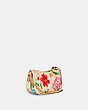 COACH®,SWINGER BAG 20 WITH QUILTING AND FLORAL BOUQUET PRINT,Smooth Leather,Small,Brass/Ivory,Angle View