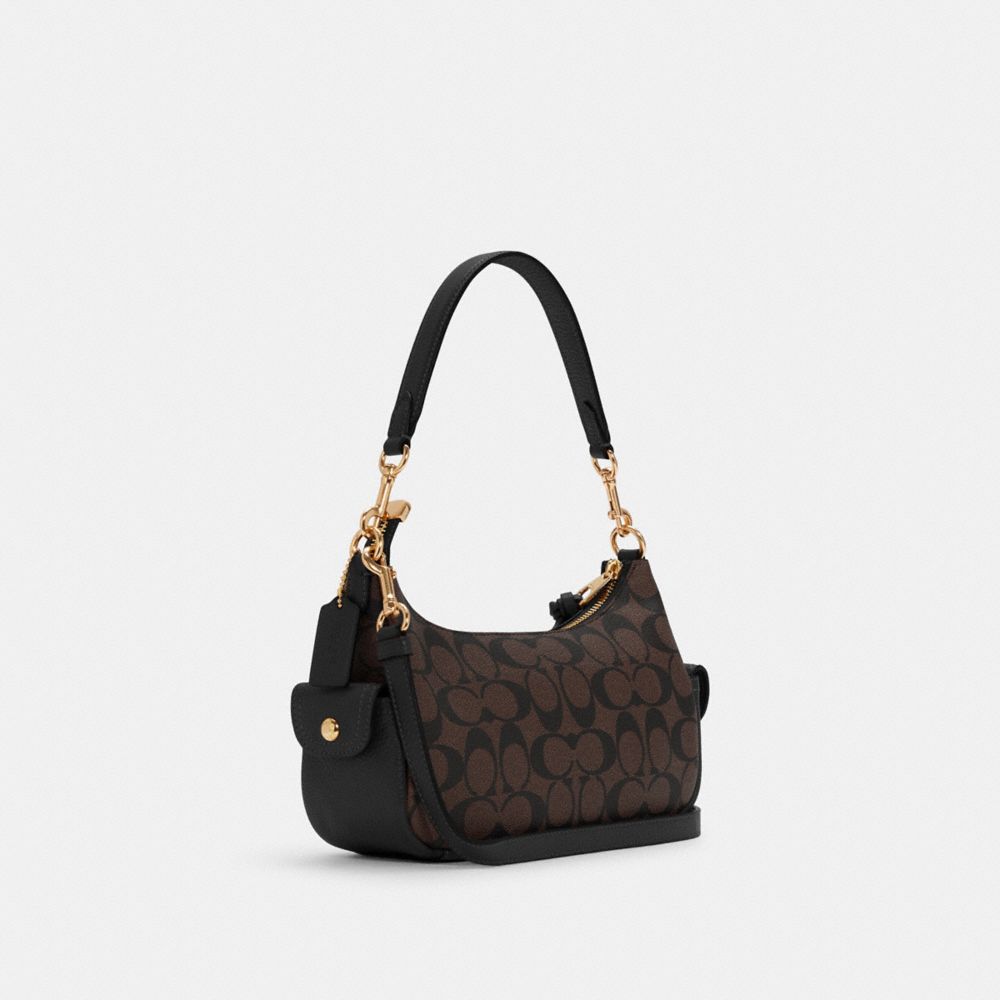 COACH®,Pennie Shoulder Bag 25 In Signature Canvas,,Angle View