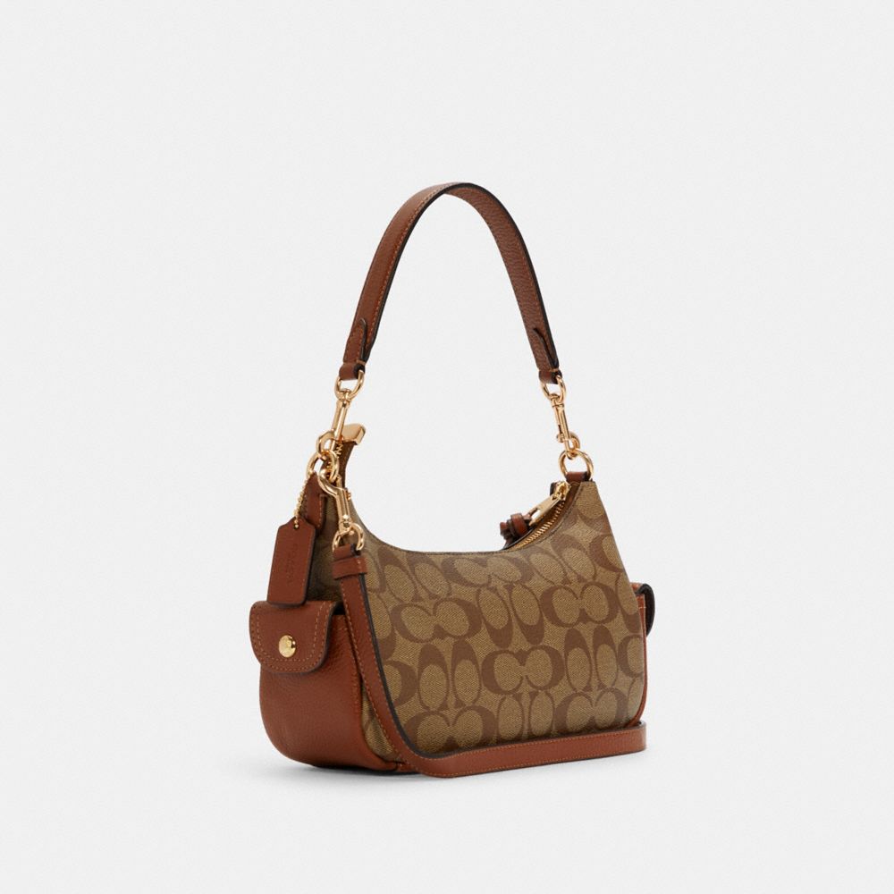 COACH®,Pennie Shoulder Bag 25 In Signature Canvas,,Angle View