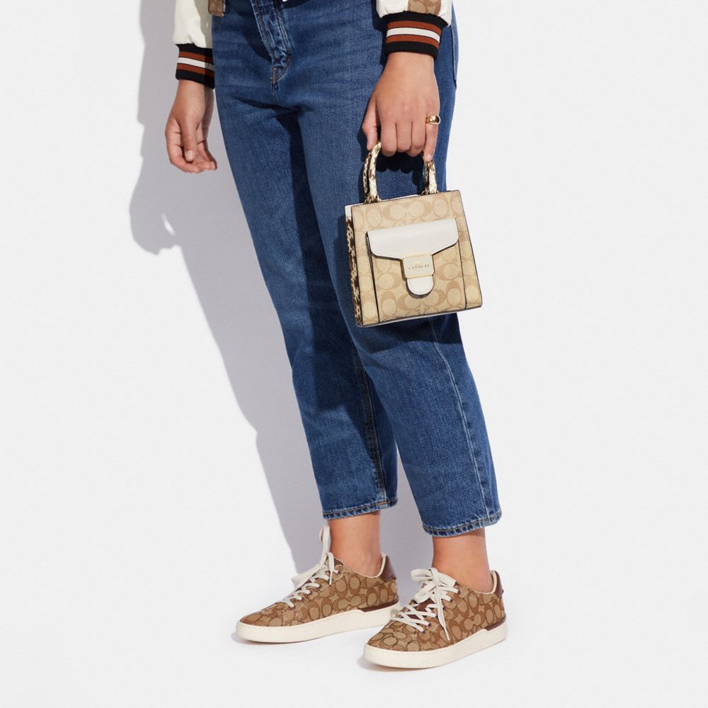 Mini Pepper Crossbody In Signature Canvas