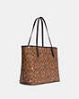 COACH®,CITY TOTE IN SIGNATURE CANVAS WITH DISCO STAR PRINT,Large,Gold/Khaki Multi,Angle View