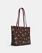 COACH®,ZIP TOP TOTE IN SIGNATURE CANVAS WITH ORNAMENT PRINT,Signature Coated Canvas/Smooth Leather,Gold/Brown Black Multi,Angle View