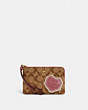 COACH®,CORNER ZIP WRISTLET IN SIGNATURE CANVAS WITH DISCO PATCHES,Gold/Khaki Multi,Front View