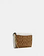 COACH®,TAMMIE CLUTCH CROSSBODY IN SIGNATURE CANVAS,Signature Coated Canvas/Smooth Leather,Mini,Gold/Khaki/Chalk,Angle View