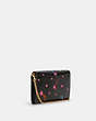 COACH®,TAMMIE CLUTCH CROSSBODY WITH DISCO STAR PRINT,Pebble Leather,Mini,Gold/Black Multi,Angle View