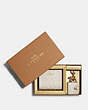 COACH®,BOXED SNAP WALLET AND PICTURE FRAME BAG CHARM IN SIGNATURE LEATHER,Mini,Gold/Chalk,Front View