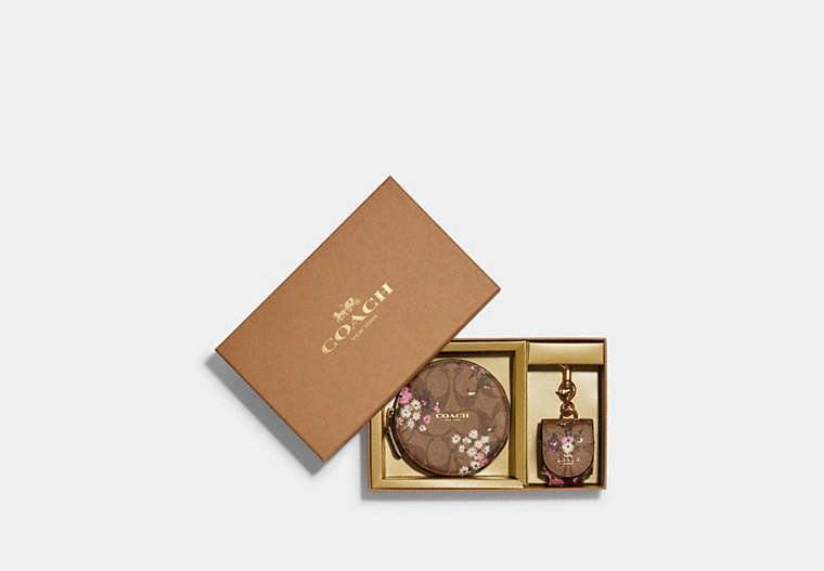COACH®,BOXED TECH ORGANIZER AND WIRELESS EARBUD BAG CHARM SET IN SIGNATURE CANVAS WITH EVERGREEN FLORAL PRINT,Mini,Gold/Khaki Multi,Front View