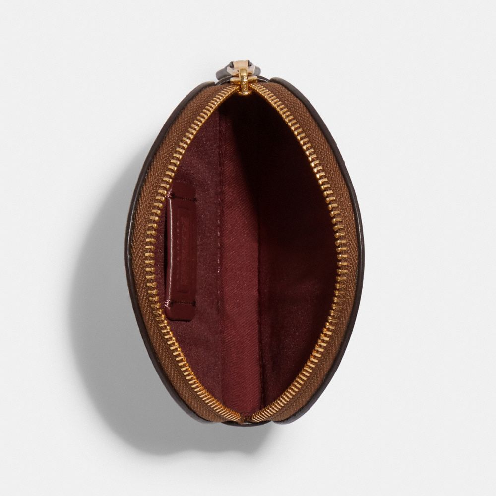 Organisateur technique en boîte et breloque de sac pour écouteurs sans fil en toile signature avec imprimé floral à feuilles persistantes