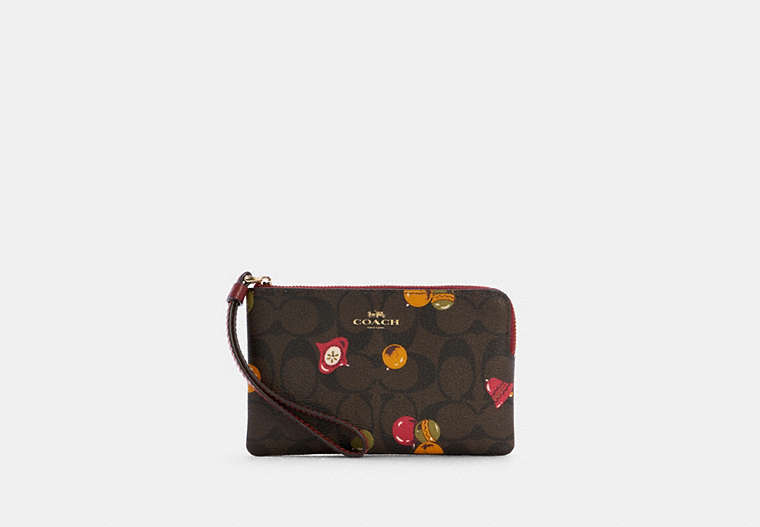 COACH®,CORNER ZIP WRISTLET IN SIGNATURE CANVAS WITH ORNAMENT PRINT,Gold/Brown Black Multi,Front View