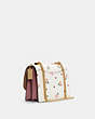 COACH®,KLARE CROSSBODY BAG WITH HEART PETAL PRINT,Leather,Medium,Gold/Chalk Multi,Angle View