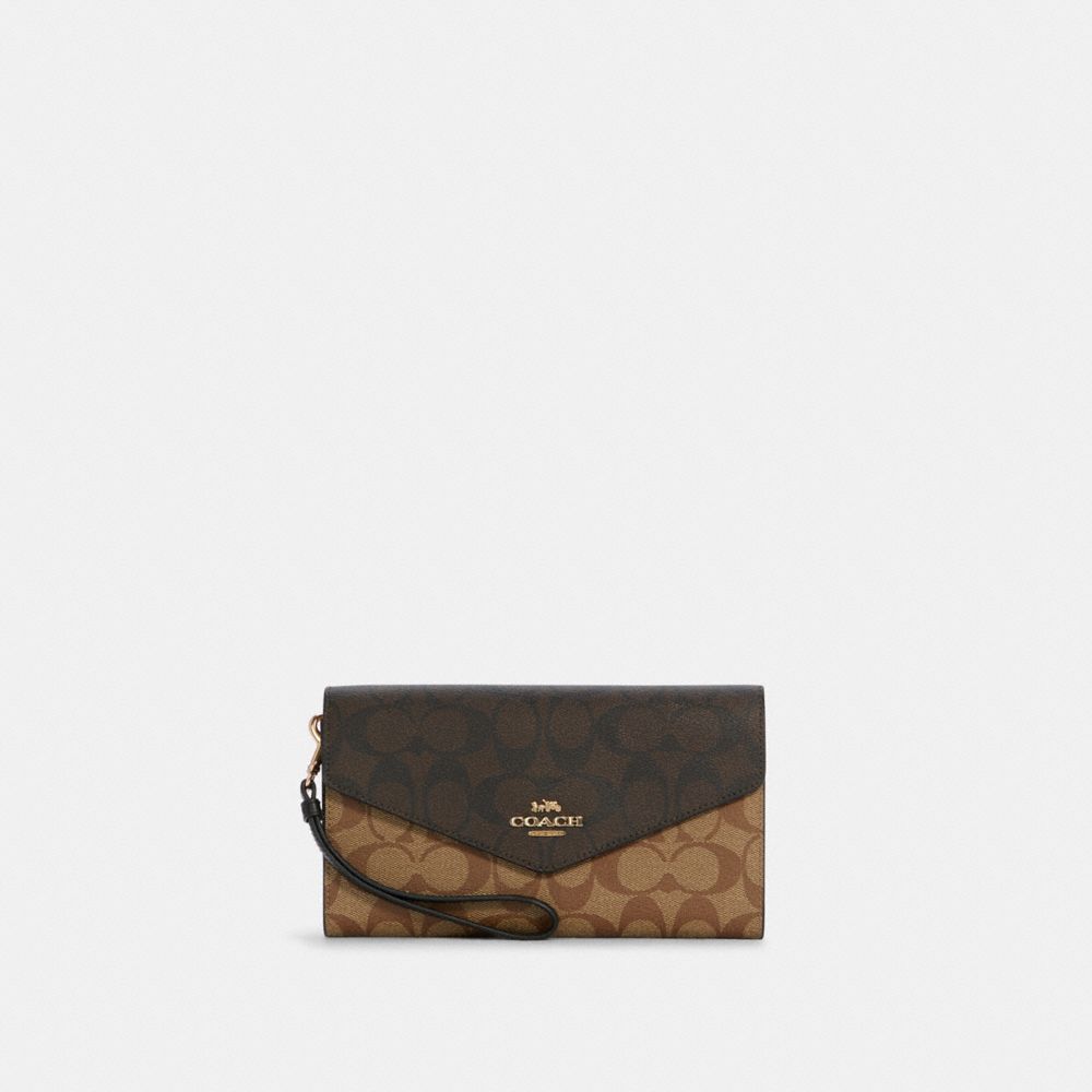COACH: envelope clutch in leather and coated canvas with logo - Beige