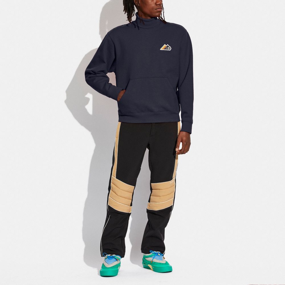 Pocket Turtleneck In Organic Cotton