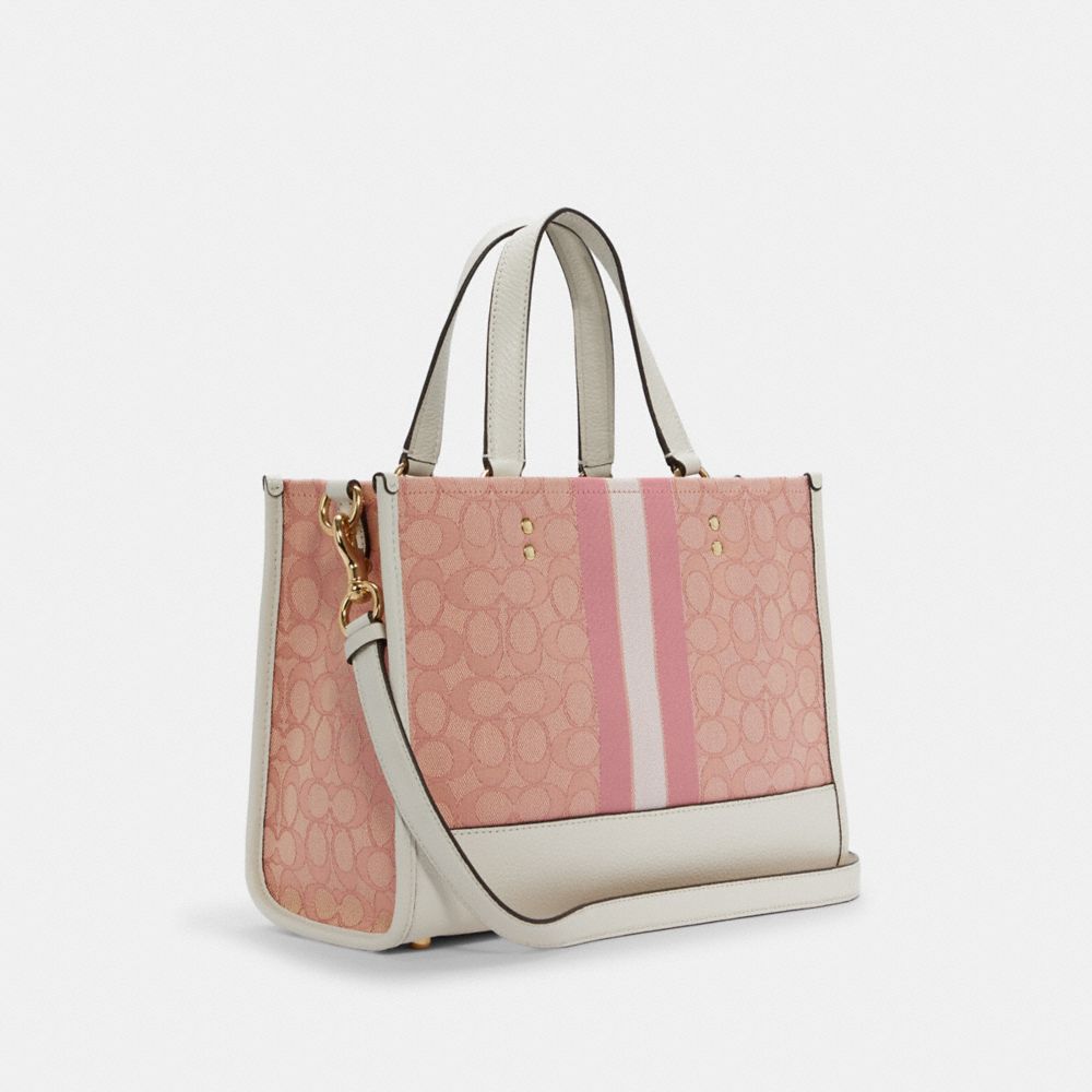 Buy the Coach Pink Signature Pattern Canvas Tote Bag Flower Charm